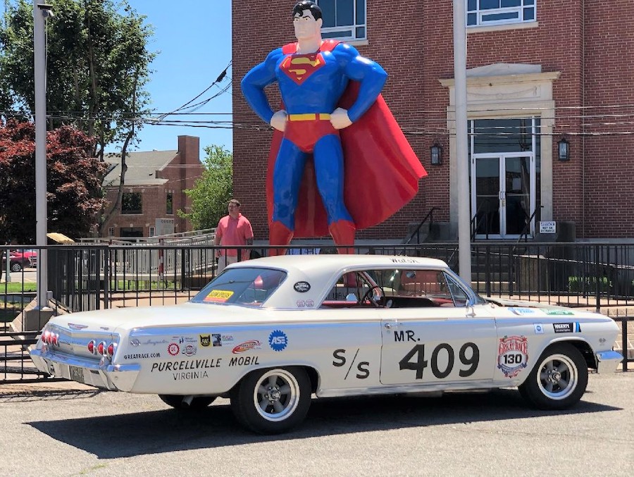 Mr. 409 poses with Superman on a pitstop along the way in the Great Race 2021.