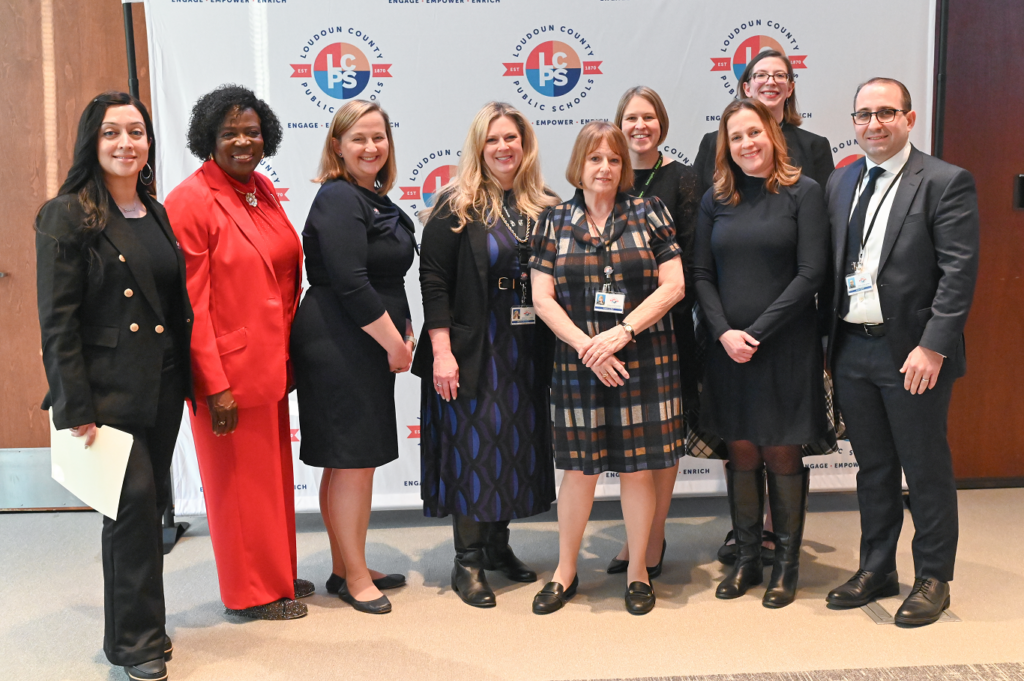 Group photo from LCPS. From left to right: Sumera Rashid (Little River District), Linda W. Deans (Broad Run District), April M. Chandler (Algonkian District), Melinda Mansfield (Dulles District), Kari LaBell (Catoctin District), Deana L. Griffiths (Ashburn District), Lauren E. Shernoff (Leesburg District),, Anne P. Donohue (At-Large) and Arben Istrefi (Sterling District).