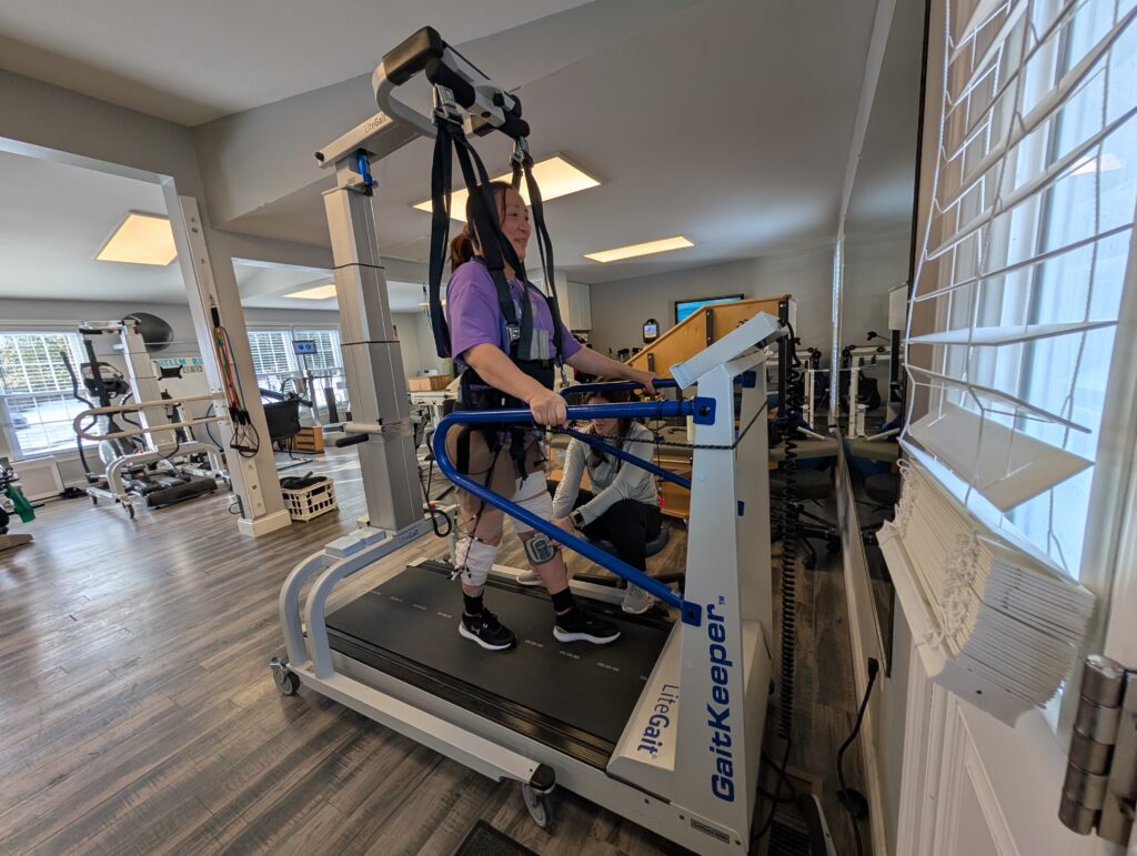 Kelly Han, an Ability Fitness Center client, exercises with the help of one of the center’s two LiteGait
400D powered harnesses. The center recently purchased a second LiteGait funded in part by a grant from the Christopher & Dana Reeve Foundation National Paralysis Resource Center. (The Arc of
Loudoun)